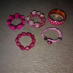 5 pink bracelets